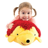 Girl smiling while holding Harry the Sensory Hedgehog