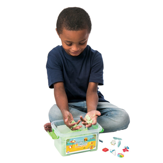 Boy playing with the weighted sand kit
