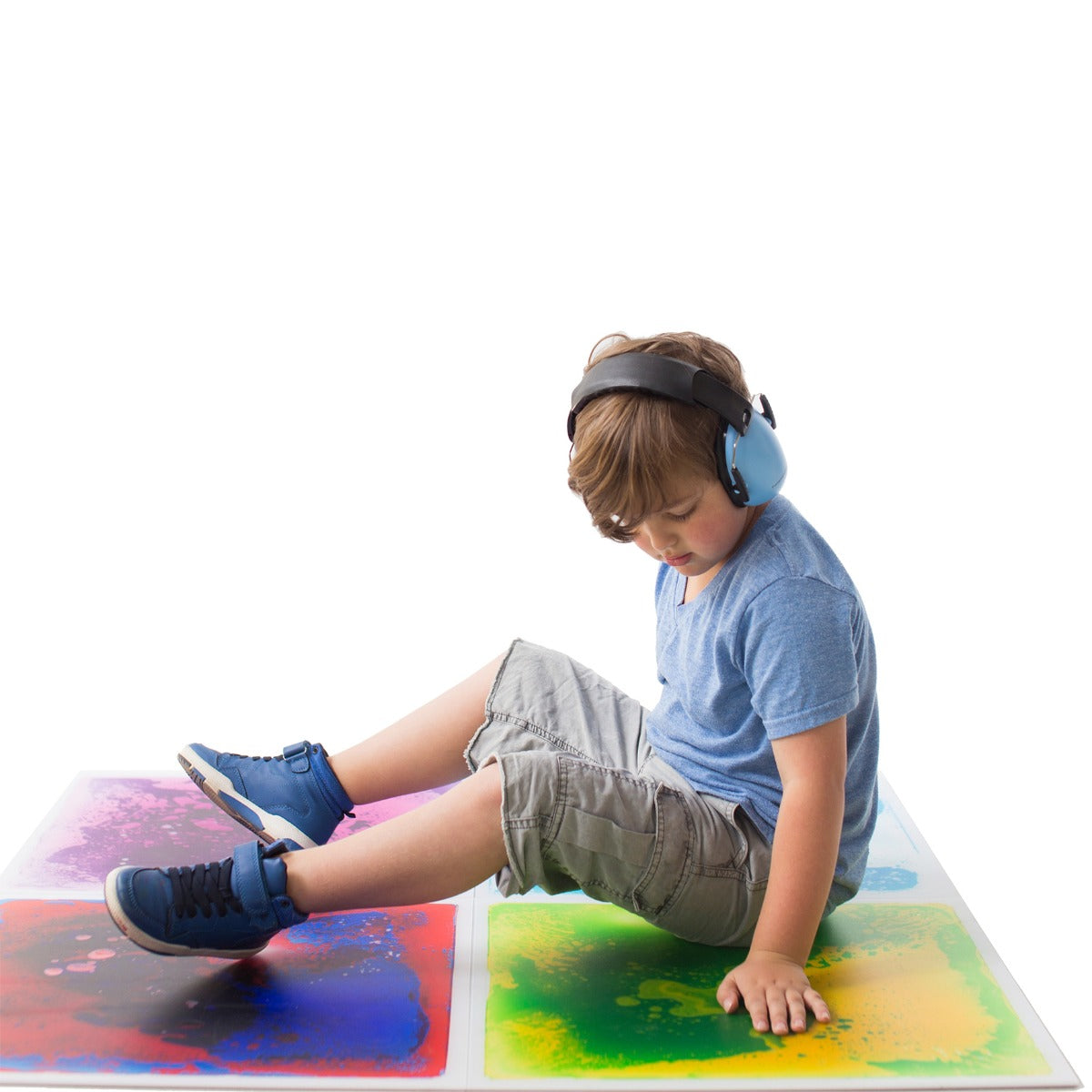 Boy sitting on the Gel Floor Tiles