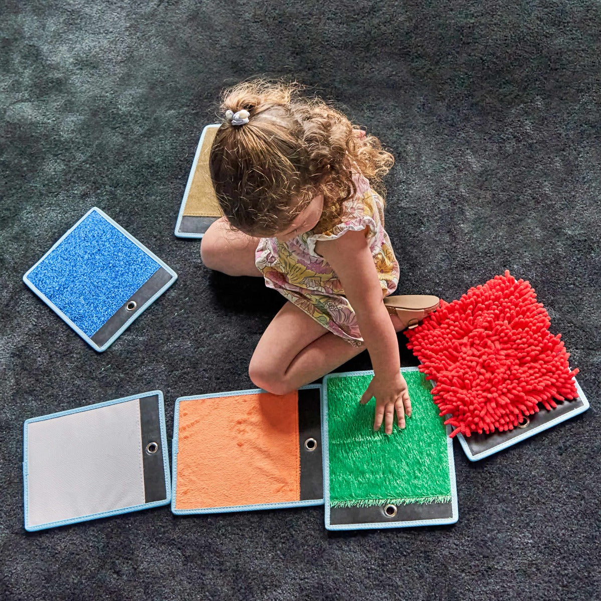Girl playing with the Sensory Mini Mats