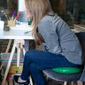 Girl sitting on the green Teen Gel Cushion