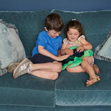 Boy and girl playing with the Weighted Shimmery Turtle