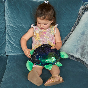 Girl playing with the Weighted Shimmery Turtle