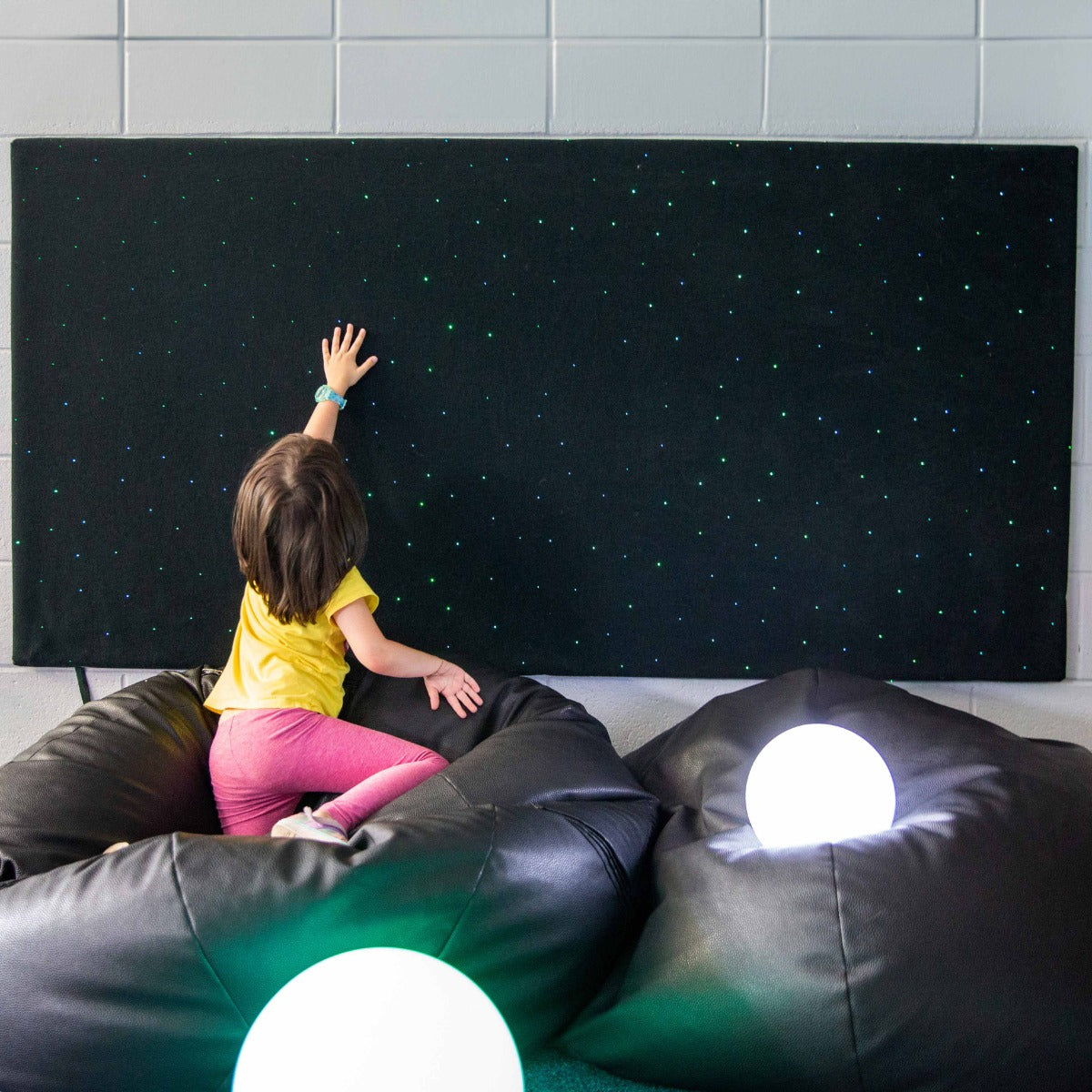 Girl touching the Fiber Optic Wall Carpet with Lightsource