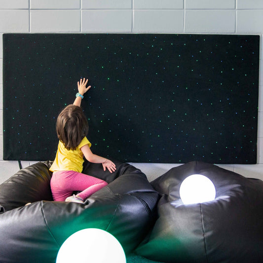 Girl touching the Fiber Optic Wall Carpet with Lightsource