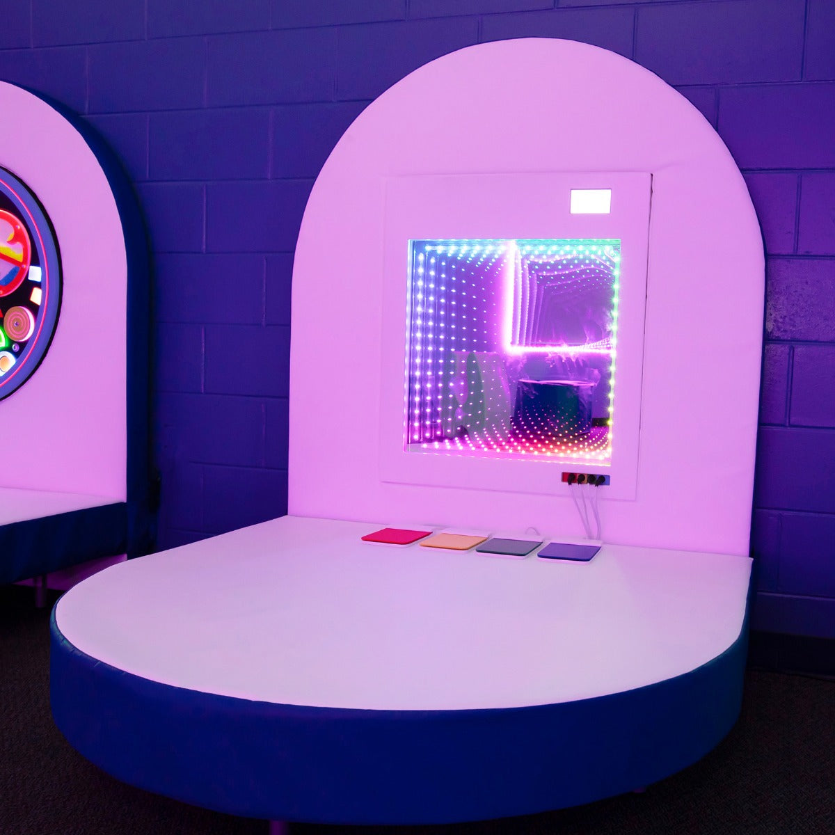 room featuring the Fiber Optic Infinity Light Panel on blue and white platform