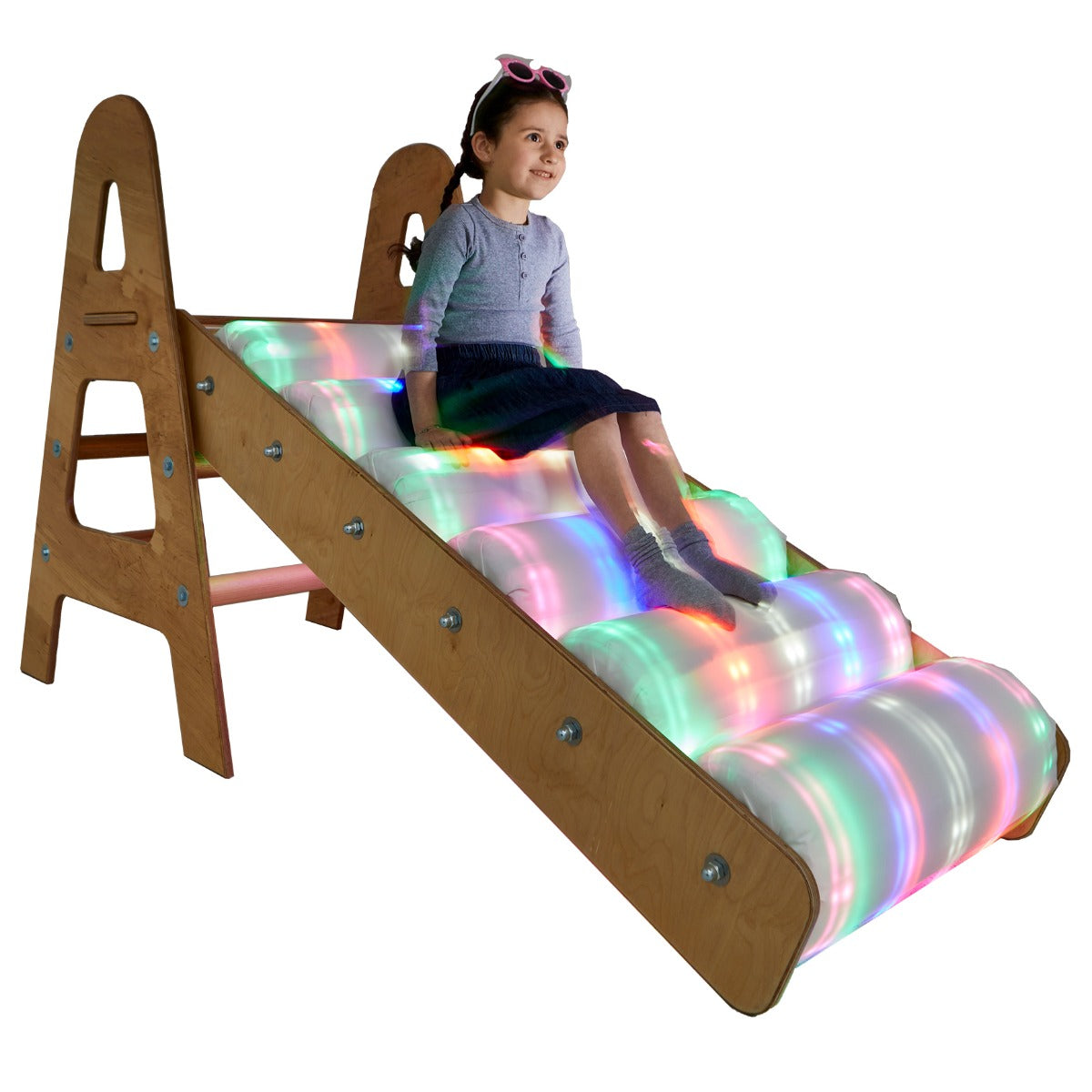Girl smiling whiles using the LED Sensory Roller Slide