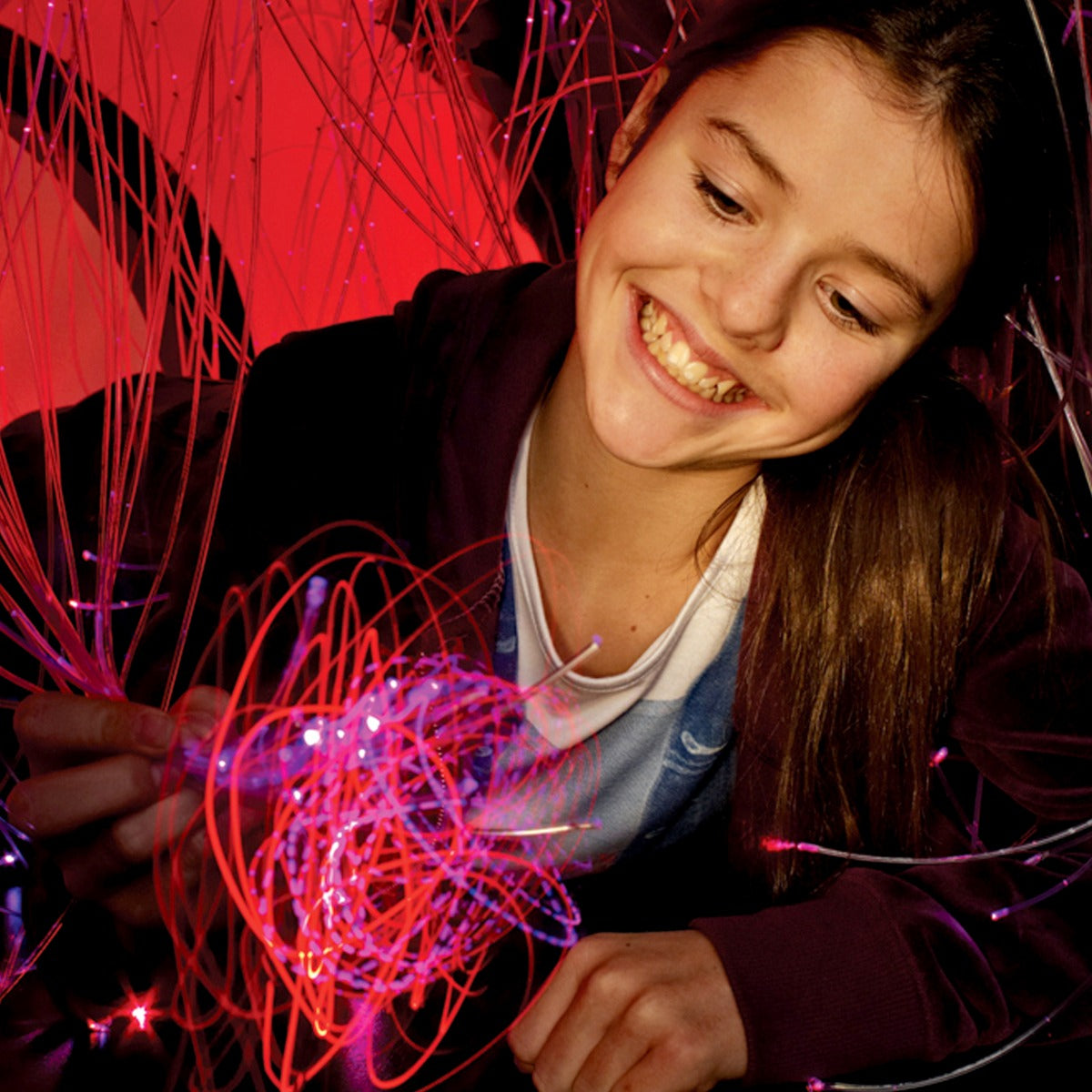 Girl playing with the Fiber Optic LED Strands With Lightsource