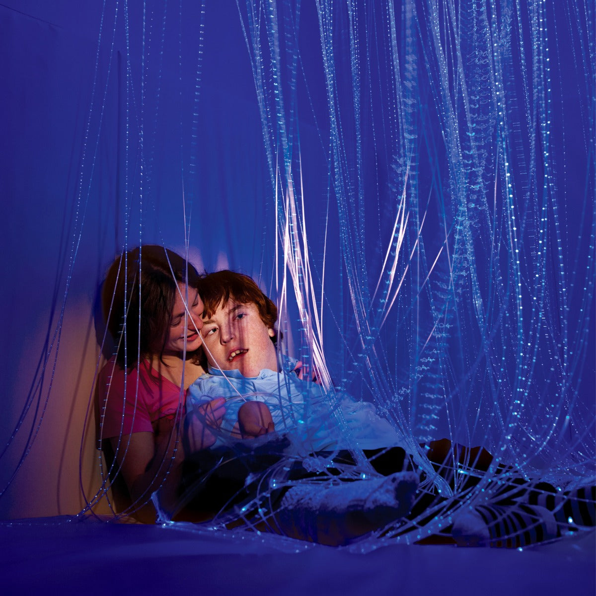 Adult and child playing with the Fiber Optic LED Strands With Lightsource