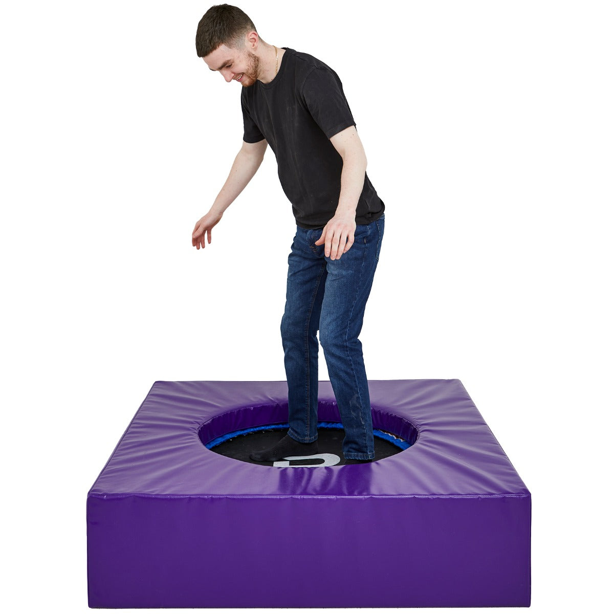 Boy smiling while jumping on the SensaSoft Platform Trampoline
