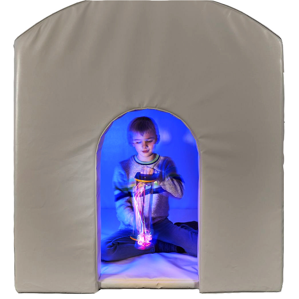 Child playing with a sensory toy inside the SensaSoft Hideaway