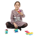 Girl playing with the Busy Fingers 3D Foldables™
