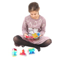Girl playing with the Busy Fingers 3D Foldables™