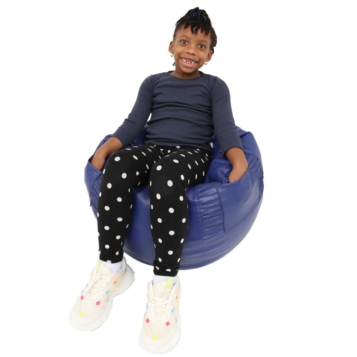 Child smiling while sitting on the blue Tough and Textured Beanbag Chair