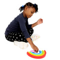 Girl playing with the Rainbow Stacker