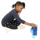 Girl playing with the Wooden Wave Stacker