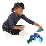 Girl playing with the Wooden Wave Stacker