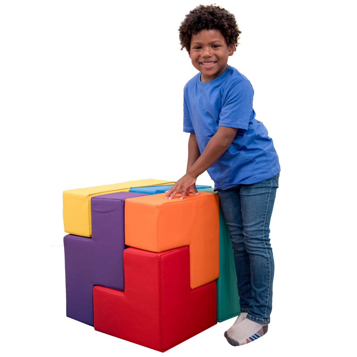 Boy smiling while playing with the SensaSoft Puzzle Cubes