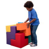 Boy smiling while playing with the SensaSoft Puzzle Cubes