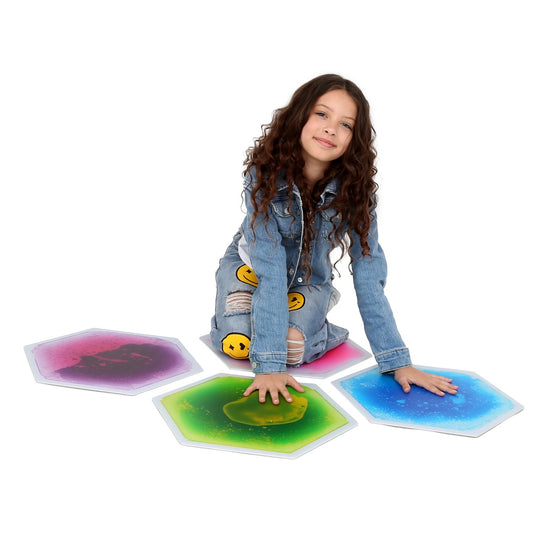 Child pressing on a gel tiles