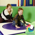 Mother helping child using the SensaSoft Sit 'N Spin for sensory play