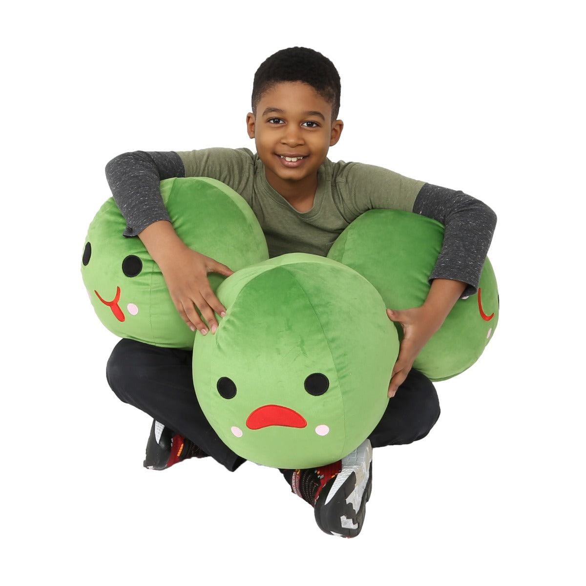 Boy smiling while holding the Peace In A Pod