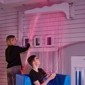 Girl and Boy playing with the Fiber Optic Light Strands on Swing Arm