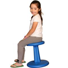 Girl smiling while sitting on a blue Wobble Chair