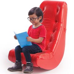 Child reading on the red Concentration Rocker