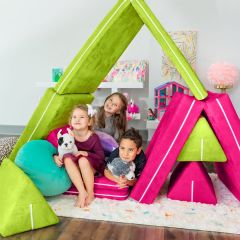 three children happily laying on the Zipline PlayScape Convertible Kids Couch
