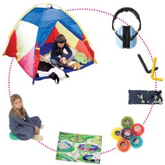 boy sitting in a tent with noise Reduction Headphones, Find Me Lap Pad, Wiggle Cushion, CheweLs, Squeeze Lizards, Grabbers  