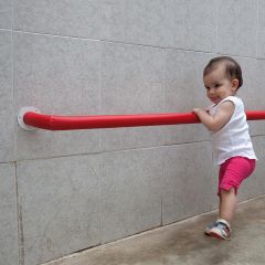 Child using the red Walking Bar