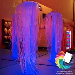 A room containing the SensaSoft™ Fiber Optic Fountain - White upholstery with multi-colored lights