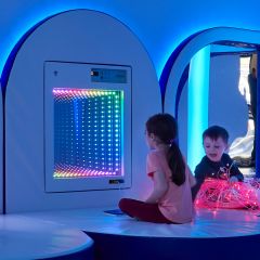 Children playing with the Fiber Optic Infinity Light Panel