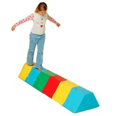 Girl walking on the Yellow, blue, green and red Balance Beam